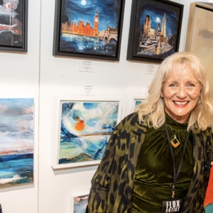 Amanda Lyon-Smith in front of some of her art
